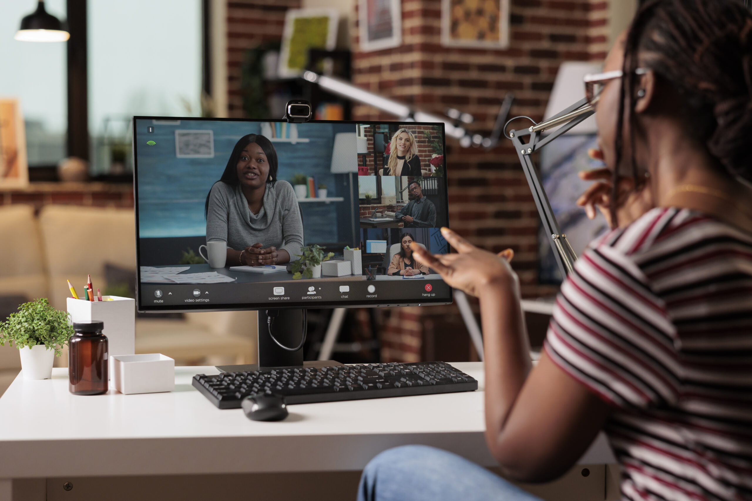 Remote Worker Talking With Team Videocall Online Briefing Videoconference Communication Telework Concept Woman Chatting Virtual Meeting Focus Computer Screen Back View Scaled